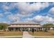 Spacious community building with covered seating area, picnic tables, and lush green lawn at 255 Decatur Dr, Summerville, SC 29486
