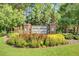 Inviting entrance to Old Rice Retreat at Cane Bay Plantation with colorful landscaping and brick accents at 255 Decatur Dr, Summerville, SC 29486