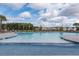 Large community pool with palm trees and lounge chairs offers a refreshing space for relaxation at 255 Decatur Dr, Summerville, SC 29486