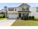 Charming two-story home with a well-manicured lawn, attached two-car garage, and inviting front porch at 255 Decatur Dr, Summerville, SC 29486