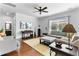 A cozy living room features neutral tones, hardwood flooring, and ample natural light at 255 Decatur Dr, Summerville, SC 29486