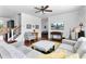 Bright living room featuring hardwood floors, ceiling fan and comfortable gray sofas and love seat at 255 Decatur Dr, Summerville, SC 29486