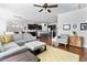 Open-concept living room with hardwood floors connecting kitchen, dining, and seating areas at 255 Decatur Dr, Summerville, SC 29486