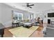 Spacious living room with modern decor, hardwood floors, and a large window at 255 Decatur Dr, Summerville, SC 29486