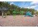 Community playground features play equipment, slide, swings, and climbing structure for enjoyment at 255 Decatur Dr, Summerville, SC 29486