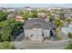 Drone shot of the building showing well-kept greenery, parking spaces, and the backdrop of the distant skyline at 259 E Bay St # 7C, Charleston, SC 29401