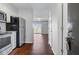 The entryway features a view to the living room and stainless steel appliances in the adjacent kitchen at 259 E Bay St # 7C, Charleston, SC 29401