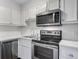 The kitchen features white subway tile backsplash, stainless steel appliances, and white cabinets at 259 E Bay St # 7C, Charleston, SC 29401