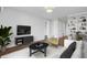 Bright living room features modern decor and a stylish entertainment center at 259 E Bay St # 7C, Charleston, SC 29401