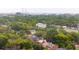 A vibrant city skyline with a bridge, framed by lush green trees and charming residential neighborhood homes at 293 Grove St, Charleston, SC 29403