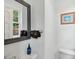 Clean bathroom with sink and toilet, enhanced by a mirror and soft towels for a modern look at 293 Grove St, Charleston, SC 29403