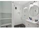 Bathroom featuring a white vanity, glass-enclosed shower, and an open storage shelf at 293 Grove St, Charleston, SC 29403