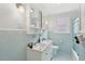 Bathroom features a double vanity, blue tile, and a bright, clean space at 293 Grove St, Charleston, SC 29403