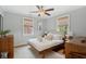 Inviting bedroom features a ceiling fan, neutral tones, and a cozy bed at 293 Grove St, Charleston, SC 29403