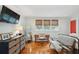 Cozy bedroom featuring hardwood floors, light blue walls, and a designated work space at 293 Grove St, Charleston, SC 29403