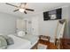 Well lit bedroom features a ceiling fan, mirror and hardwood floors, for a comfortable living space at 293 Grove St, Charleston, SC 29403
