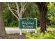 Welcome to the Historic Wagener Terrace community sign nestled among mature trees and lush greenery at 293 Grove St, Charleston, SC 29403
