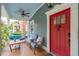 Cozy front porch featuring comfortable seating, a ceiling fan, and a view of the charming neighborhood at 293 Grove St, Charleston, SC 29403