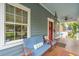 Inviting porch with comfortable seating, a ceiling fan, and a view of the home's exterior details at 293 Grove St, Charleston, SC 29403