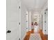 Hallway with hardwood floors provides access to rooms, each promising comfort at 293 Grove St, Charleston, SC 29403