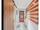 Inviting hallway with a barn door, an American flag, and plenty of space for a cozy welcome at 293 Grove St, Charleston, SC 29403