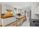 Well-appointed kitchen features white cabinets, granite countertops, and an island for added workspace and storage at 293 Grove St, Charleston, SC 29403