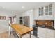 Bright kitchen features white cabinets, stone countertops, and stainless steel appliances, offering both style and functionality at 293 Grove St, Charleston, SC 29403