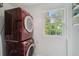 Functional laundry area with stacked washer/dryer and a window, offering convenience and natural light at 293 Grove St, Charleston, SC 29403