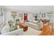 Open concept living room featuring hardwood floors, modern furnishings, and ample space for entertaining at 293 Grove St, Charleston, SC 29403