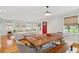 Inviting living space showcases hardwood floors, ample natural light, and a seamless flow between living, dining, and kitchen areas at 293 Grove St, Charleston, SC 29403