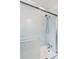 Shower with sleek glass door features tile surround and updated fixtures at 293 Grove St, Charleston, SC 29403