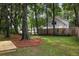 Backyard featuring mature trees, wooden fencing and room to enjoy the outdoors at 2960 Blackfish Rd, Johns Island, SC 29455