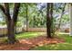 Well maintained backyard with mature trees and a wooded perimeter at 2960 Blackfish Rd, Johns Island, SC 29455