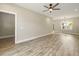 Spacious living room with vinyl plank flooring, ceiling fan, recessed lighting, and view to the backyard at 2960 Blackfish Rd, Johns Island, SC 29455