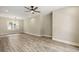 Bright, open living room with vinyl plank flooring, modern ceiling fan, and recessed lighting at 2960 Blackfish Rd, Johns Island, SC 29455