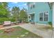 Large backyard featuring blue siding, a brick patio, and a cozy fire pit at 300 Foxglove Ave, Summerville, SC 29483