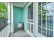 Relax on this cozy covered balcony with a chair and enjoy views of the surrounding trees at 300 Foxglove Ave, Summerville, SC 29483
