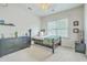 Light and airy bedroom with ceiling fan and dark furnishings, including a low platform bed at 300 Foxglove Ave, Summerville, SC 29483