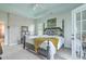 This primary bedroom features a four-poster bed, white carpet, and tray ceiling with a ceiling fan at 300 Foxglove Ave, Summerville, SC 29483