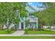 Charming two-story home with a porch, balcony, well-maintained lawn and lush landscaping at 300 Foxglove Ave, Summerville, SC 29483