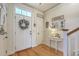 Bright foyer with hardwood floors, decorated entry table and natural light at 300 Foxglove Ave, Summerville, SC 29483