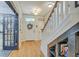 Bright foyer with hardwood floors, staircase and charming details at 300 Foxglove Ave, Summerville, SC 29483