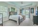 Well-lit main bedroom with a four-poster bed and access to a private balcony at 300 Foxglove Ave, Summerville, SC 29483