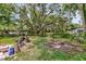 Backyard featuring tall trees and greenery at 3043 Matipan Ave, North Charleston, SC 29405