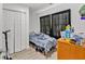 Bedroom with a twin bed, closet, and black curtains at 3043 Matipan Ave, North Charleston, SC 29405