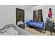 Bedroom featuring two twin beds, dark curtains and light wood flooring at 3043 Matipan Ave, North Charleston, SC 29405