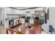 Kitchen view with stainless steel refrigerator, white cabinets, and light wood flooring at 3043 Matipan Ave, North Charleston, SC 29405