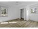 Sunlit bedroom with hardwood floors and dual windows at 313 Runnymede Ln, Summerville, SC 29485