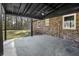 Covered patio features brick supports and spacious views at 313 Runnymede Ln, Summerville, SC 29485