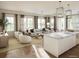 Spacious living room with large windows and contemporary design at 325 Longshore St # 1122, Daniel Island, SC 29492